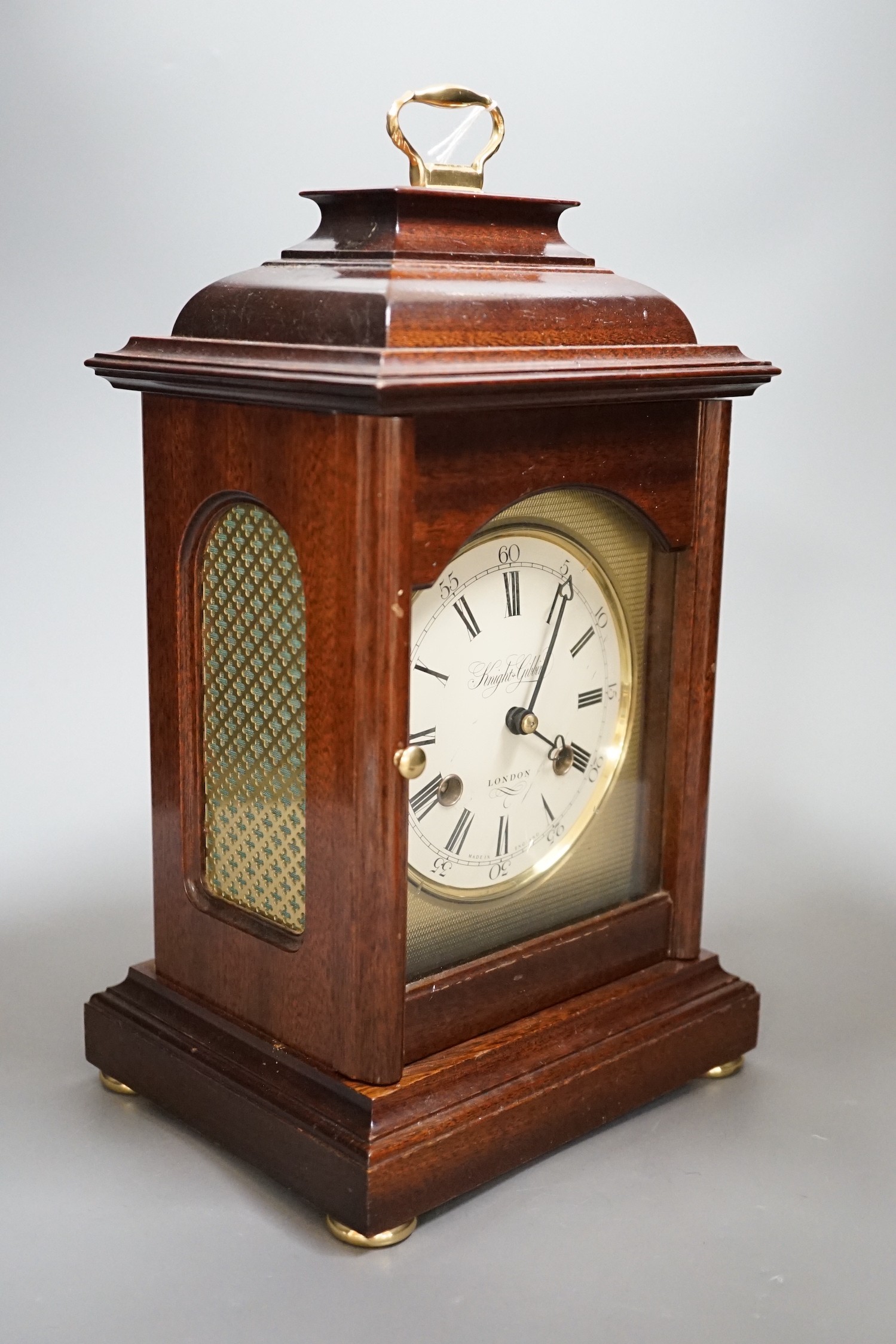 Knight and Gibbins. A reproduction mantel clock, 30c high